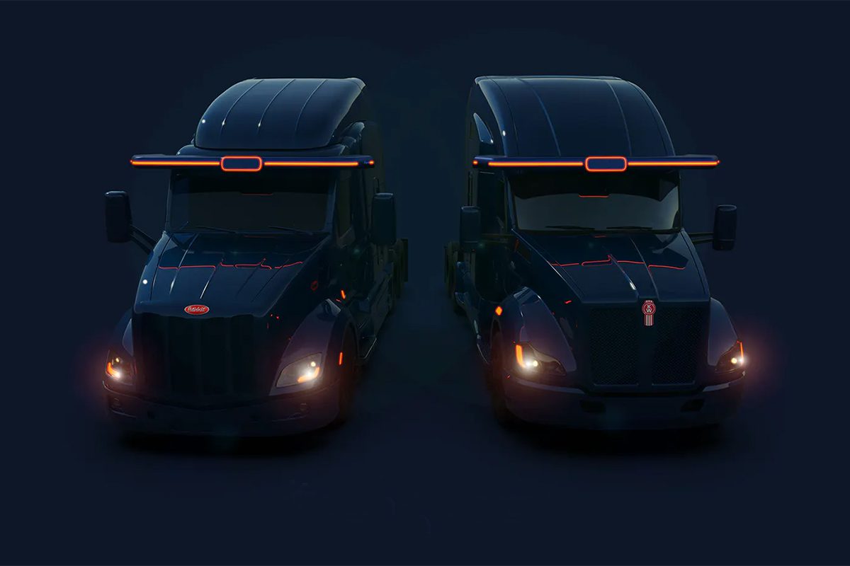 Dark concept image of two semi tractors with headlights on